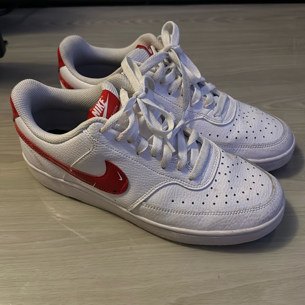 White air forces with red Nike sign. Size 8